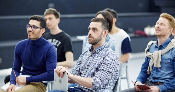 Contemporary business people attending seminar or qualification course of study